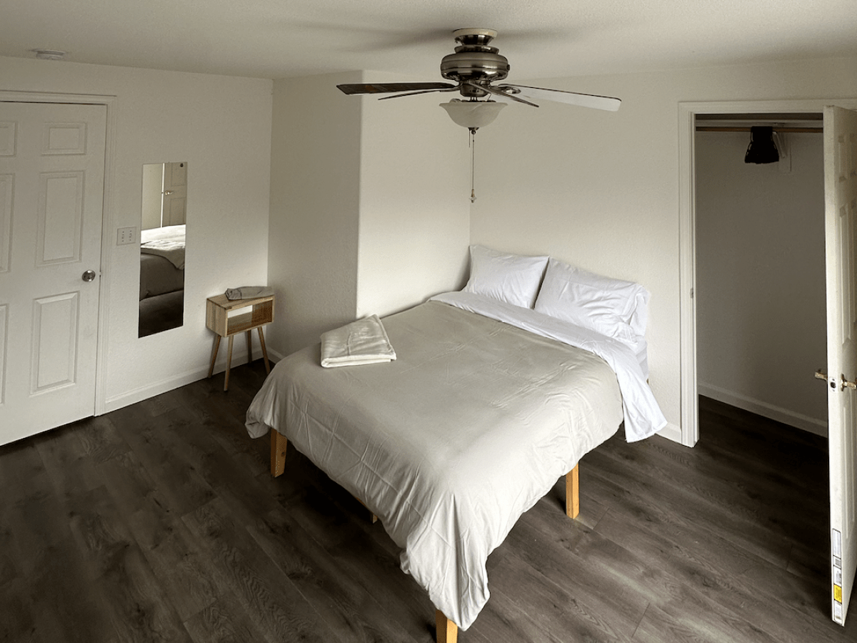 a bedroom with a bed in a room